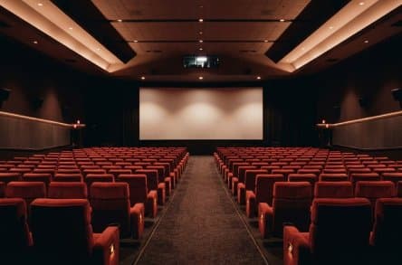 Empty cinema hall with red seats